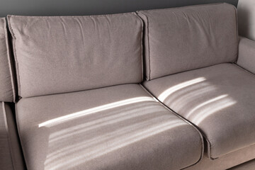 Wide sofa with sunlight pattern on it