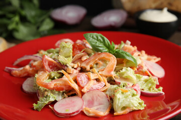 Delicious salad with mayonnaise on plate, closeup