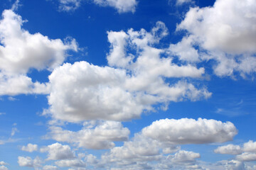 Naklejka na ściany i meble Clouds scattered over an intense blue sky