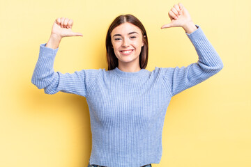 hispanic pretty woman feeling proud, arrogant and confident, looking satisfied and successful,...
