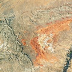 Desert land in satellite photo for background. Elements of this image furnished by NASA.