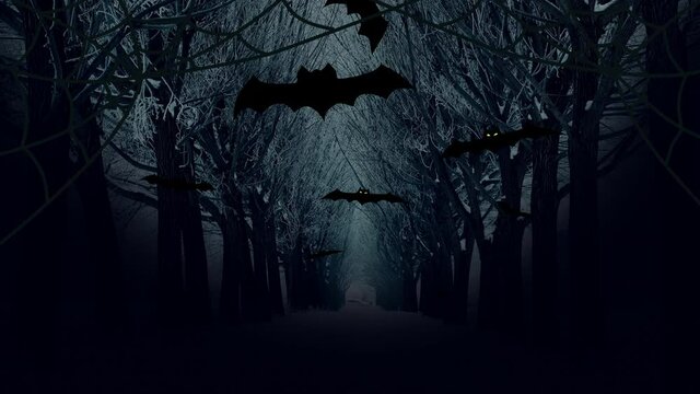 Happy halloween slogan on dark trees alley and flying black bats in twilight. Greeting carl video flyer. Group halloween bats flying on bare trees alley