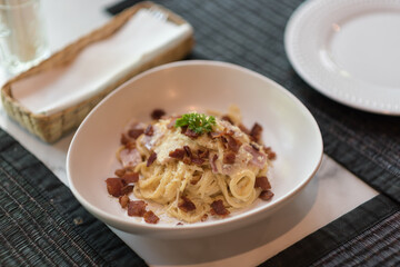 spaghetti carbonara mix with cheese and crispy bacon
