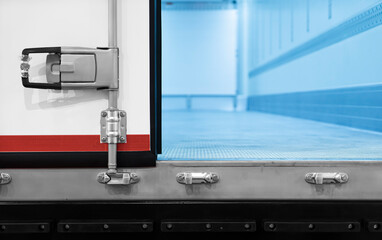 Opened door steel of a truck container with space for cargo logistics inside close up lock view