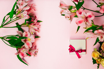Alstroemeria flower flatly with romantic present box . Beautiful romantic summer flowers, florist shop design. White gift box on pink banner with burgundy Peruvian lilies bouquets. 