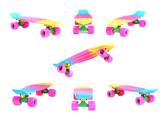 Set of different angles of pastel pink rainbow colored Penny board skateboard isolated on white...