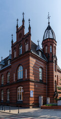 Fototapeta na wymiar historic red brick Gothic architecture building in downtown Gniezno