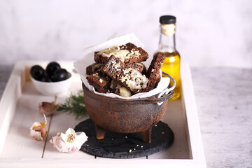 croutons with garlic and herbs are on the table