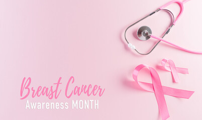 Pink ribbons and stethoscope on pastel background, Symbol of women's breast cancer awareness, Health care and medical concept.