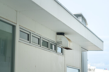 Air ventilation outlet system which is installed on the building wall. Building object photo.