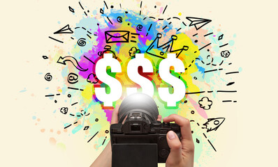 Close-up of a hand holding digital camera with abstract drawing concept