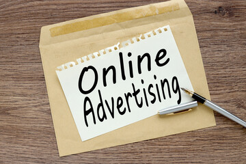 Online Advertising. Blank postcard and envelope on old wooden background
