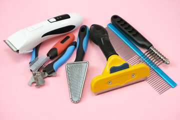 pet care and grooming tools on a pink background.