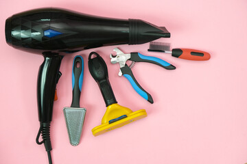 pet care and grooming tools on a pink background.