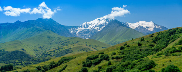 Plakat Mountains of North Ossetia, beautiful summer landscapes with blue sky and clouds.