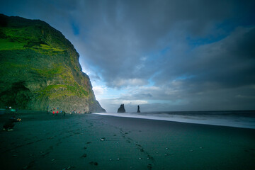 The cliffs by the township of Vik in Iceland Reynisdrangar basalt sea stacks