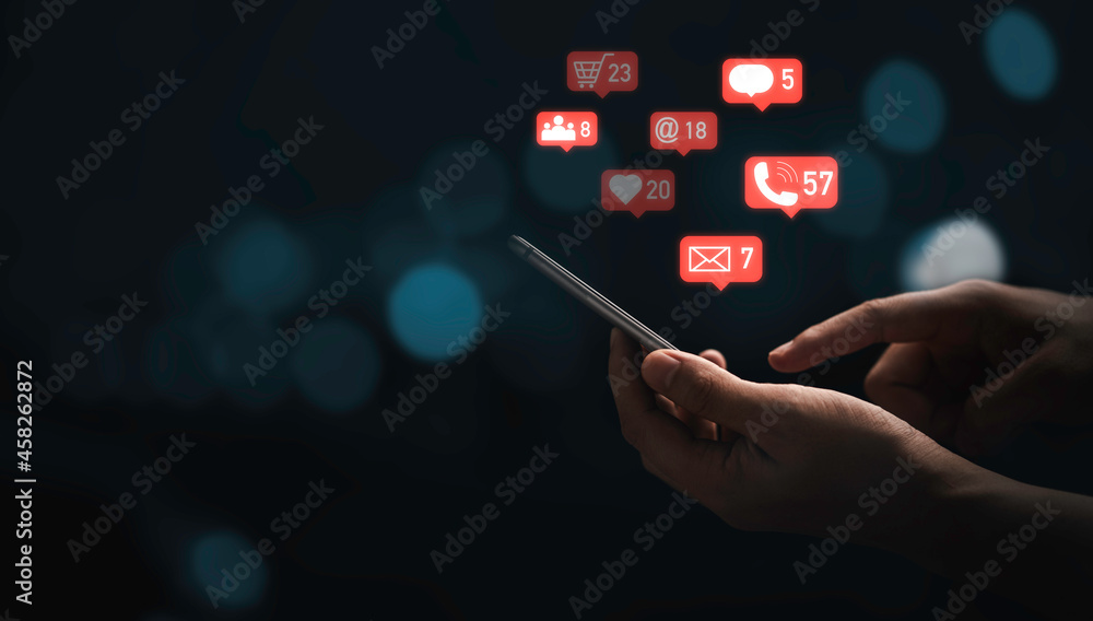 Poster hand using smartphone to send message and social media icons with blue bokeh background for marketin