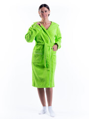 Fototapeta premium woman in a Bathrobe on an isolated white background with a smile on her face.
