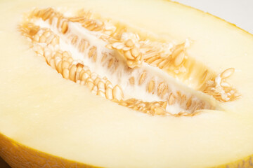 yellow ripe melon cut in half close-up, seasonal berry.