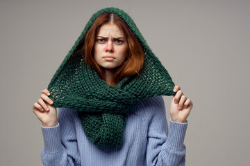 red-haired woman green scarf on the head close-up