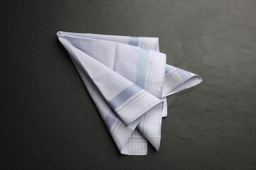 Naklejka premium Handkerchief with pattern on black table, top view