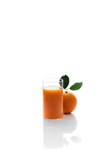 glass of orange juice and orange on white background 