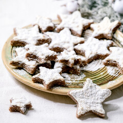 Obraz na płótnie Canvas Star shape cocoa cookies with white glaze. Christmas decorations. Copy space