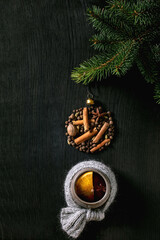 Hot mulled wine with spices and Christmas decorations