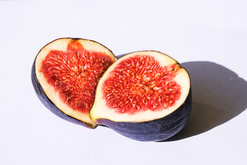 Fresh sliced ripe figs on white. Halves of fruit