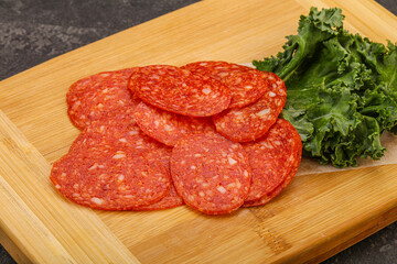 Italian spycy pepperoni sausage slices