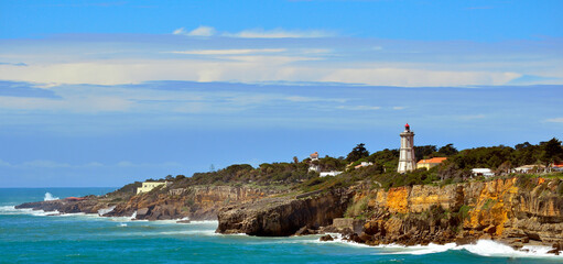 Fototapeta na wymiar Guia Lighthouse on the Rocky Coast near Cascais, Portugal