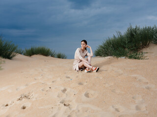 woman in coat posing beach fresh air elegant style