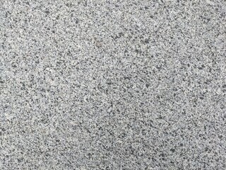 texture of a slab of gray granite stone. smooth grained stone texture