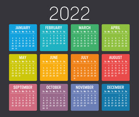 Colorful year 2022 calendar isolated on black background. Vector Template.