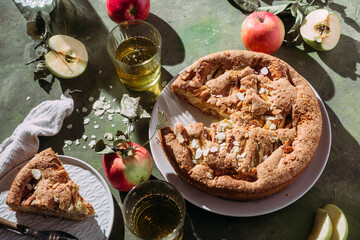 Apple pie. Sponge cake with apples on a green background