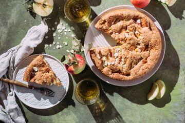 Apple pie. Sponge cake with apples on a green background