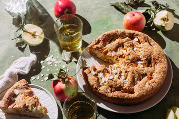 Apple pie. Sponge cake with apples on a green background