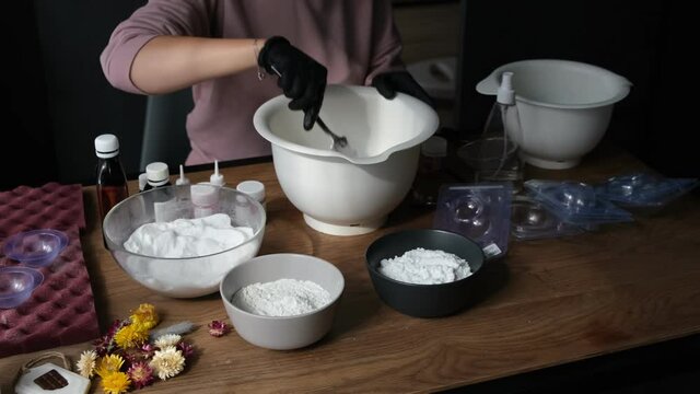 handmade bath bombs process. Preparation of bath bombs. Ingredients and floral decor on a wooden vintage table.