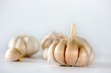 Garlic clove and bulb isolated on white background.