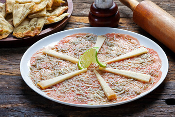 Carpaccio with grated Parmesan cheese