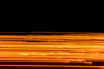 orange light lines against black background