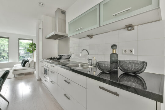 Stylish tableware placed on kitchen counter in modern apartment