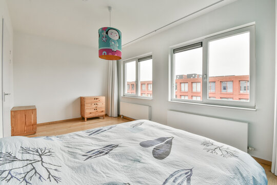Modern bedroom interior with bed and lamp in flat