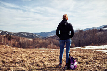 Woman enjoying on a mountain winter fresh air.