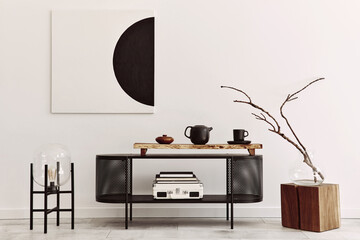 Interior design of modern living room with black stylish commode, mock up art paintings, lamp,...