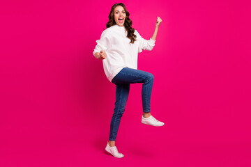 Fototapeta na wymiar Full length photo of young excited girl happy positive smile celebrate success winner isolated over pink color background