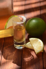 Mexican Gold Tequila in Shot Glass with Lime and Salt