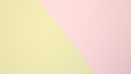 Top view of a beautiful obliquely overlapping yellow and pink paper photograph. images for beautiful backgrounds