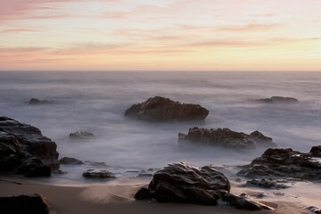 Fototapeta na wymiar Rocky seascape at dusk