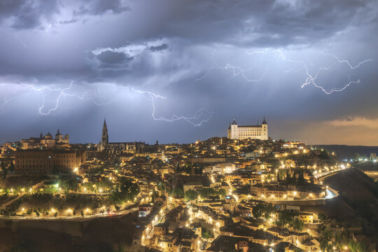 Picturesque cityscape with aged castle in night time